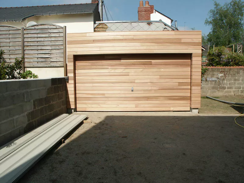 Garage en ossature bois avec bardage bois réalisé par Pasquereau